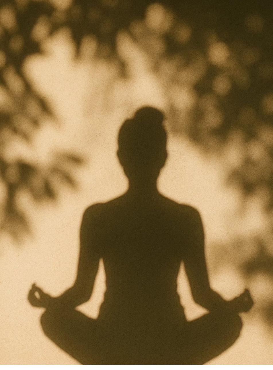 Meditation silhouette in golden light